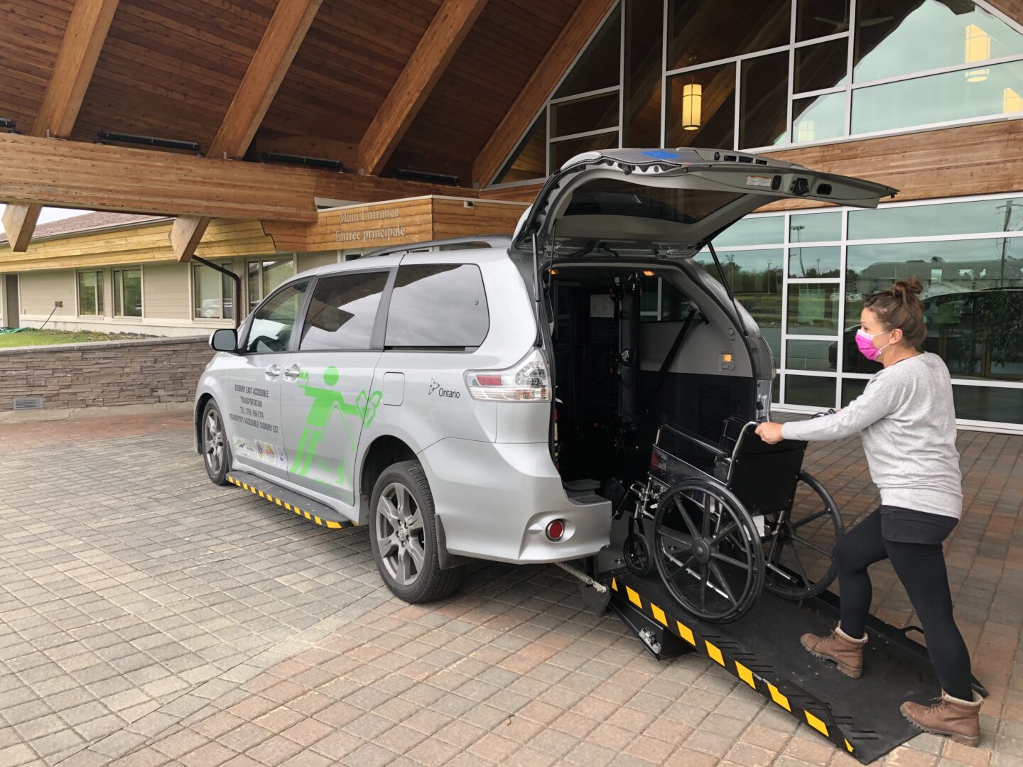 Rear image of the minivan with tailgate and ramp opened for wheelchairs, dedicated to the SEAT project, Sudbury East Accessible Transportation.